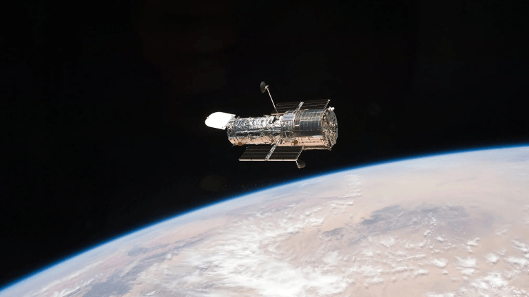 A Cosmic Figure-Eight: Hubble Captures Gravity Warping the Fabric of Space